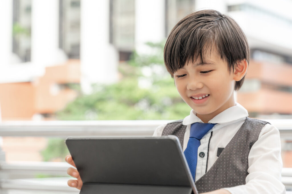 male student using tablet